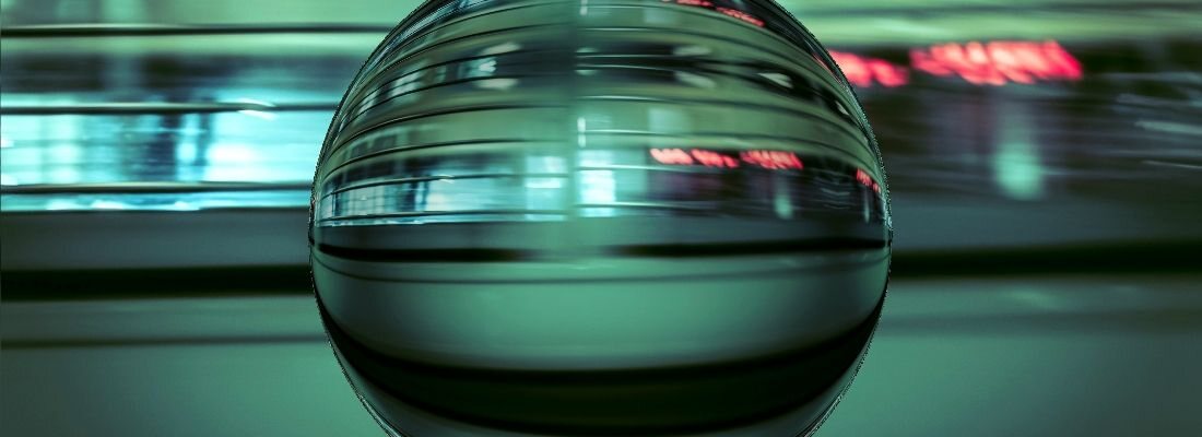A liquid-chrome sphere caught in green motion-blur — Ana Apango's signature Y2K image.